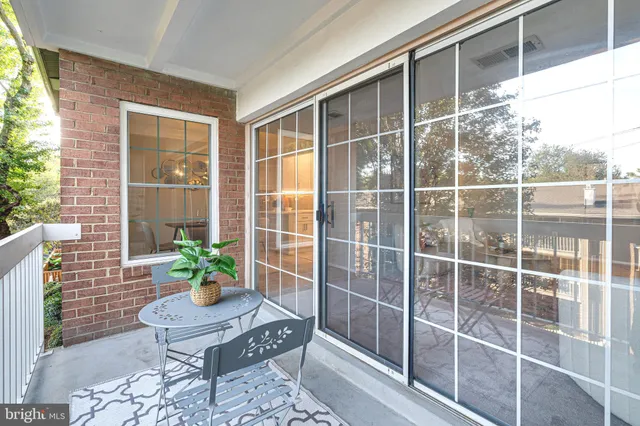a view of a chair and table in a patio