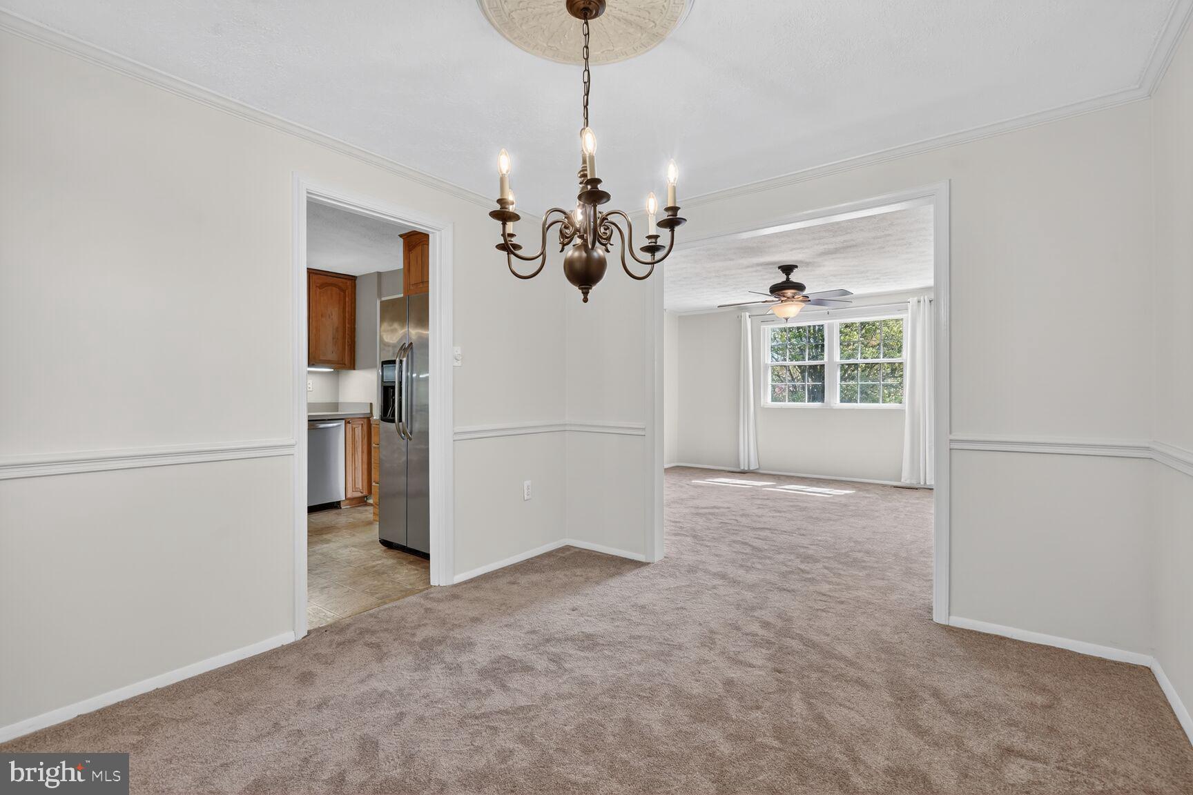 2806 Logway Road Vienna, VA 22181 - Photo 5 of 33 a view of a room with a windows and a chandelier