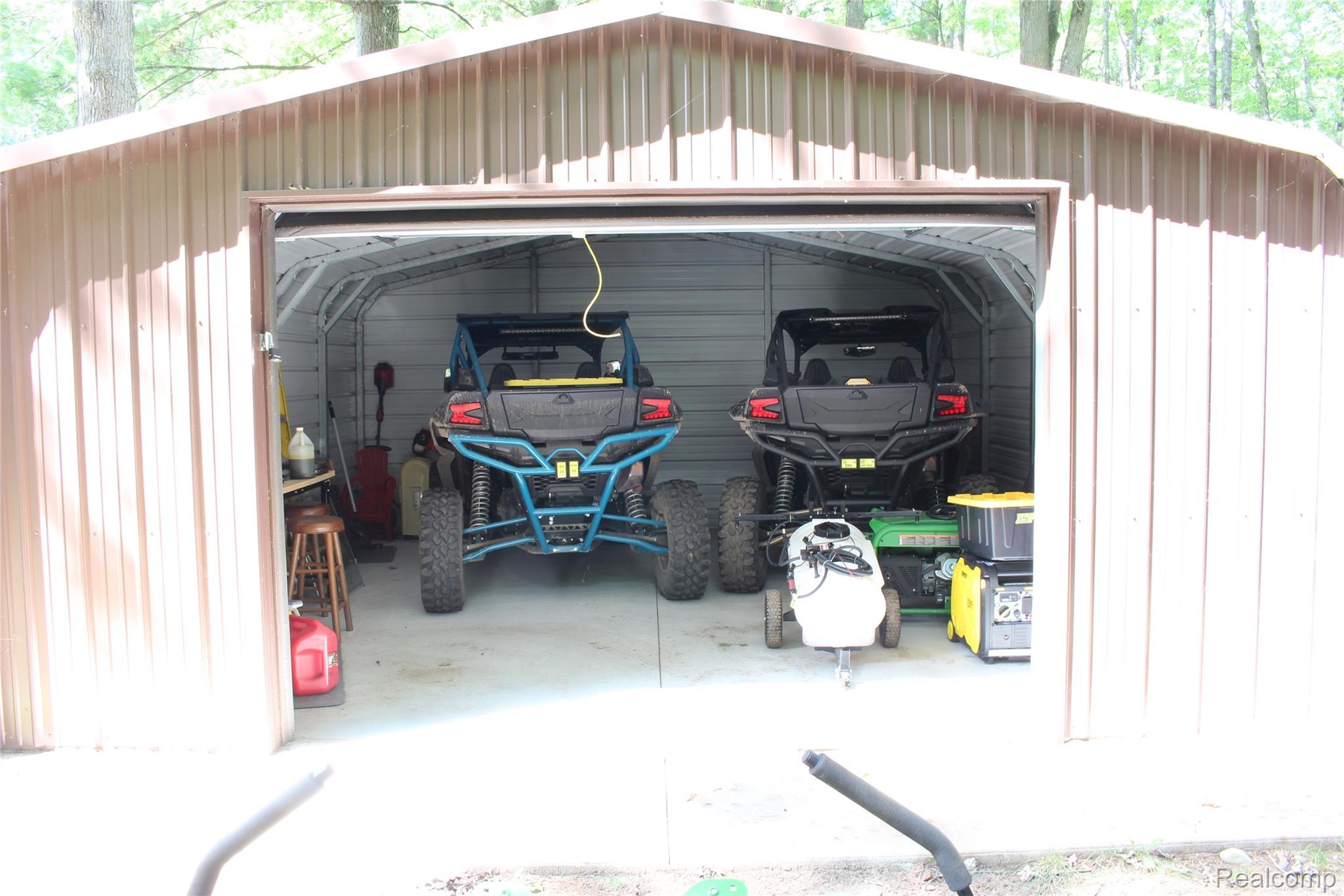 5799 Goodar Road South Branch, MI 48761 - Photo 52 of 58 Metal storage shed with a roll-up garage door for your ORV's and more