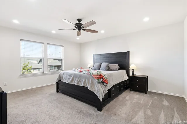 a bed room with a bed and a window