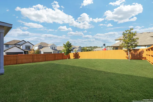 a view of a playground and basketball court