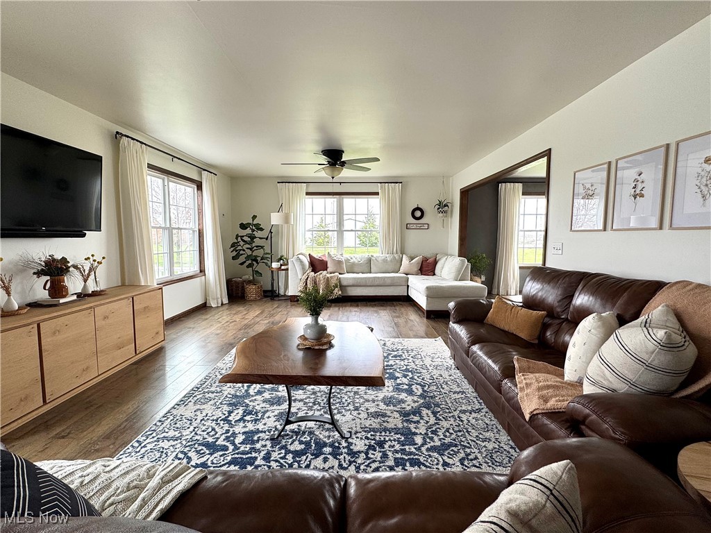 3450 Secrest Road Wooster, OH 44691 - Photo 11 of 34 Living room featuring a ceiling fan and dark wood finished floors