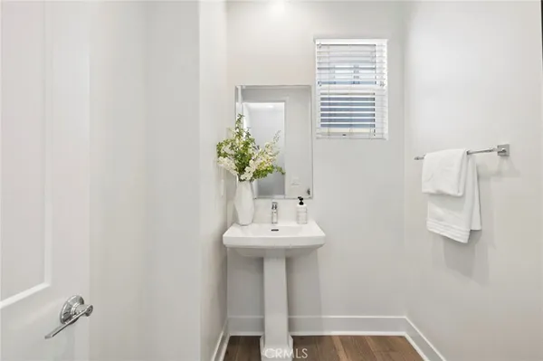 a bathroom with a sink a mirror and a window