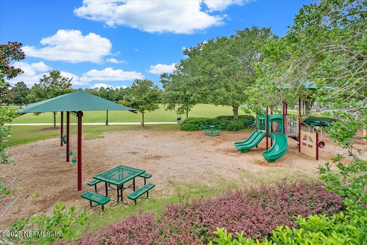 629 Pelham Road St. Augustine, FL 32092 - Photo 55 of 72 a view of a park with swings and slides
