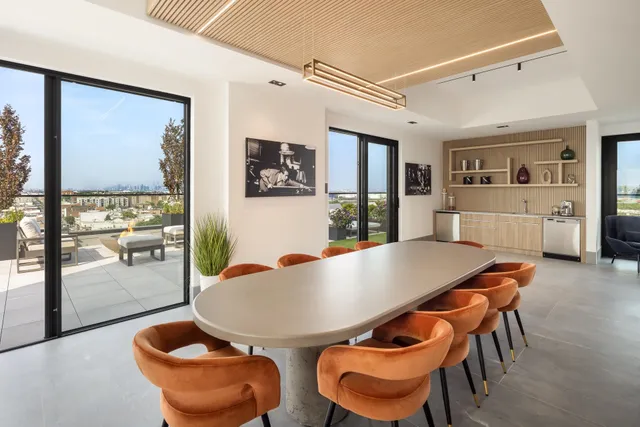 a dining room with furniture and window