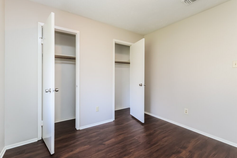 4606 Lost Lake Lane Spring, TX 77388 - Photo 14 of 16 a view of an empty room with wooden floor and closet