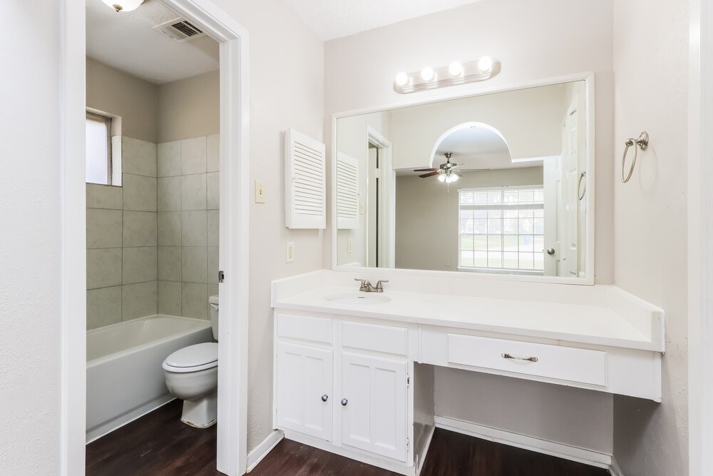 4606 Lost Lake Lane Spring, TX 77388 - Photo 15 of 16 a bathroom with a sink a toilet and shower