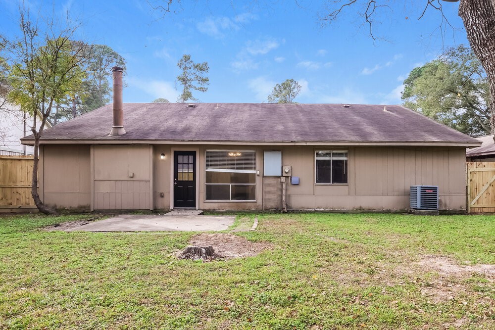 4606 Lost Lake Lane Spring, TX 77388 - Photo 16 of 16 a front view of a house with a garden and yard