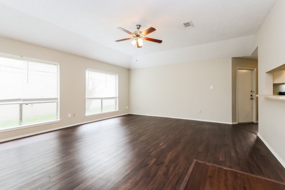 4606 Lost Lake Lane Spring, TX 77388 - Photo 5 of 16 a view of an empty room with wooden floor and a window