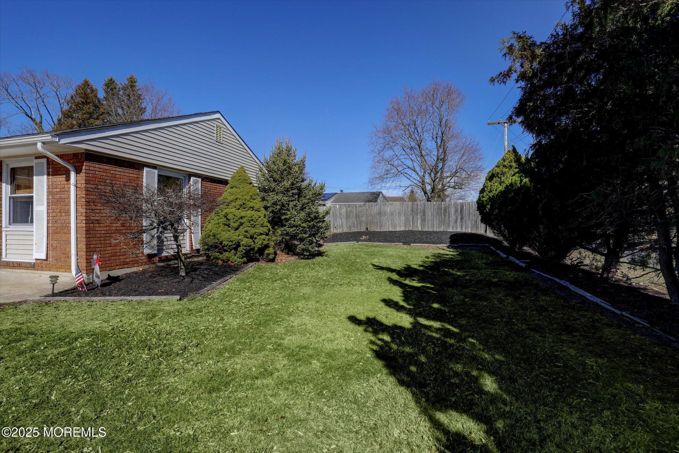 1 Peach Tree Road Oakhurst, NJ 07755 - Photo 14 of 42 a view of backyard with green space