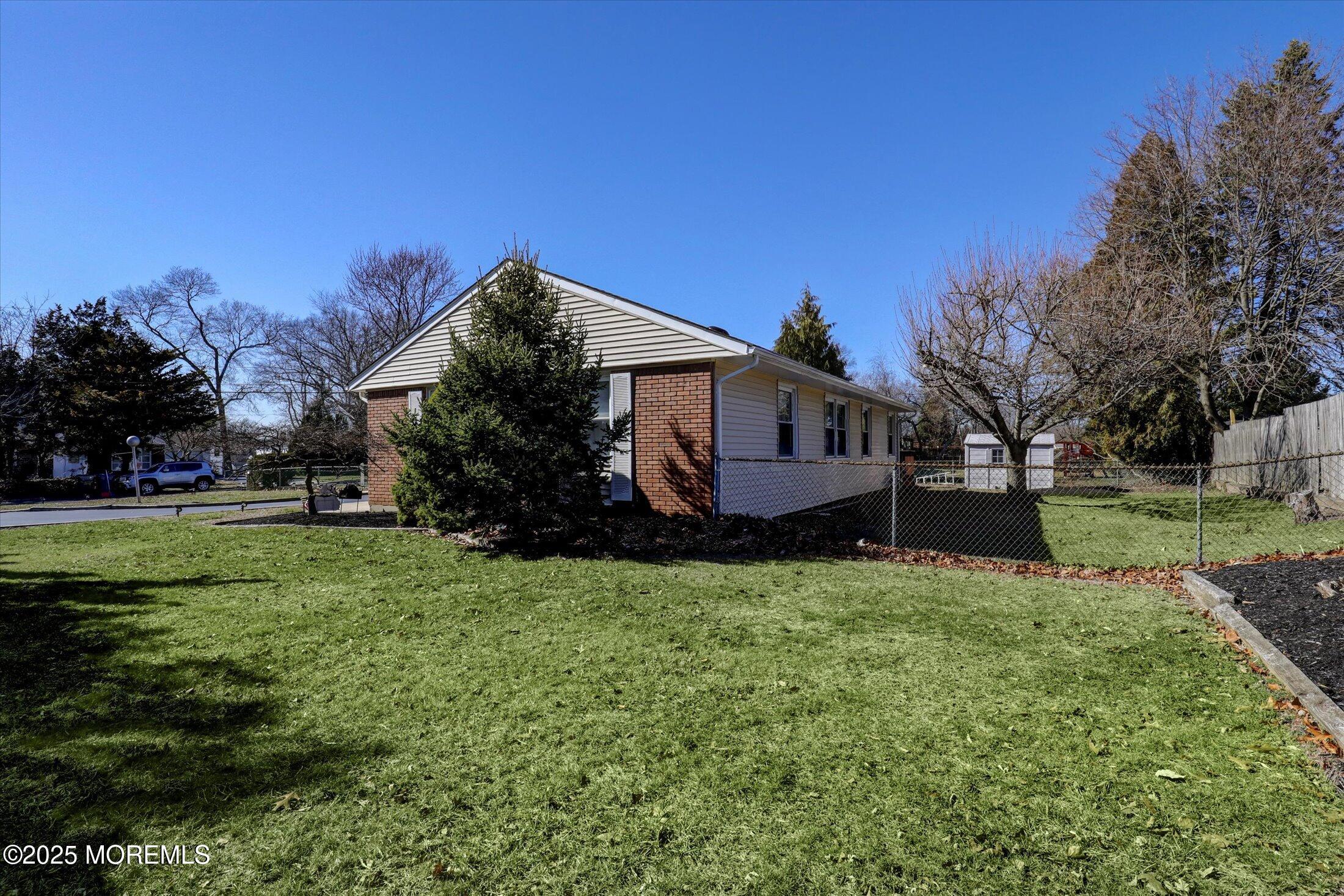 1 Peach Tree Road Oakhurst, NJ 07755 - Photo 15 of 42 a view of a house with backyard