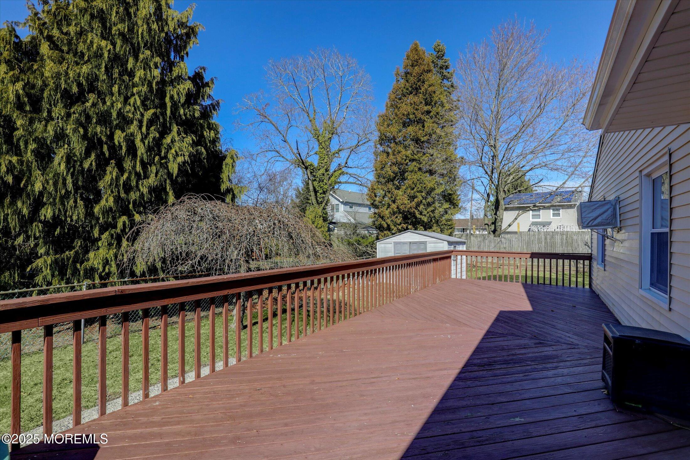 1 Peach Tree Road Oakhurst, NJ 07755 - Photo 16 of 42 a view of balcony with wooden floor and outdoor space