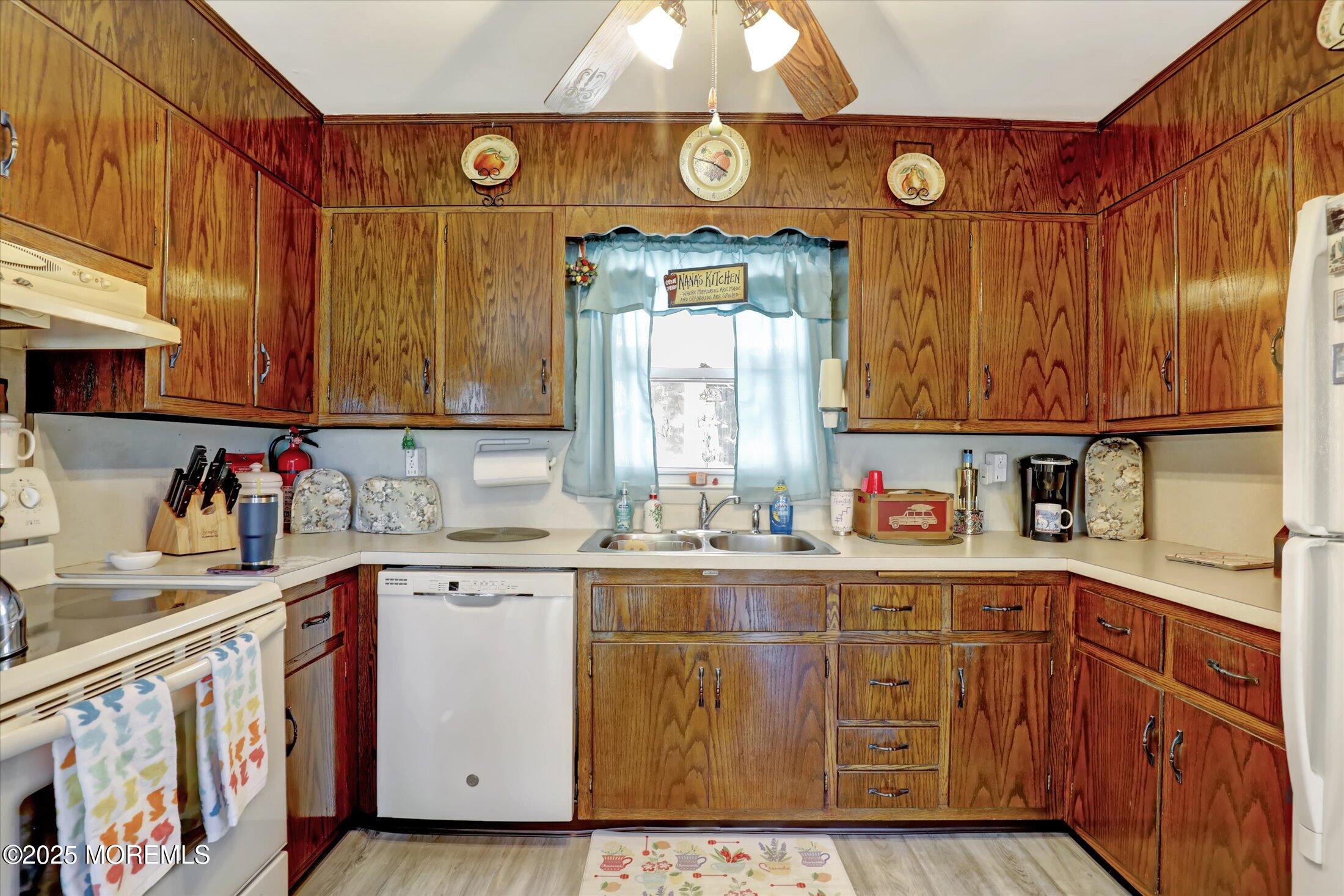 1 Peach Tree Road Oakhurst, NJ 07755 - Photo 20 of 42 a kitchen with a sink cabinets and window