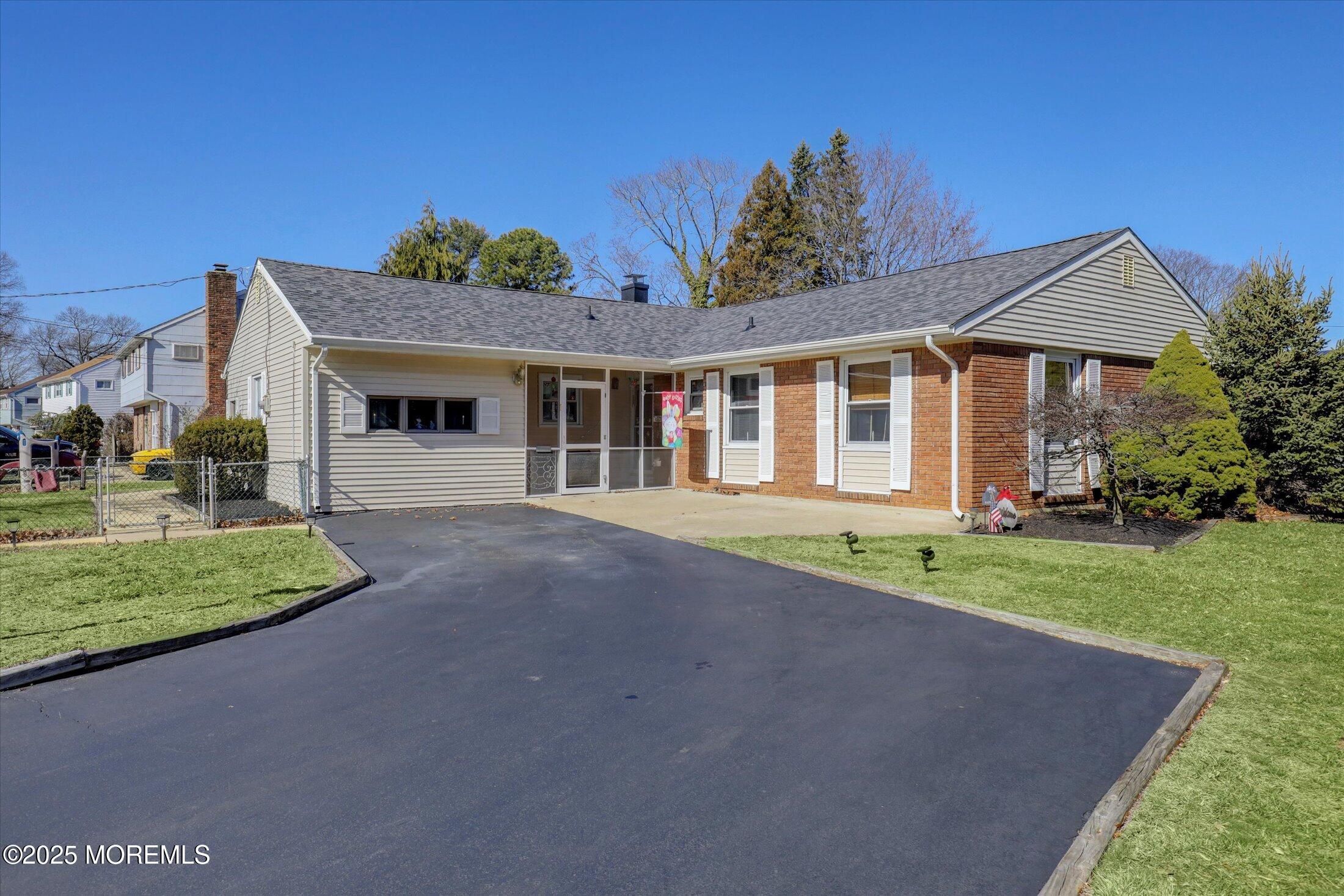 1 Peach Tree Road Oakhurst, NJ 07755 - Photo 2 of 42 a front view of a house with a yard