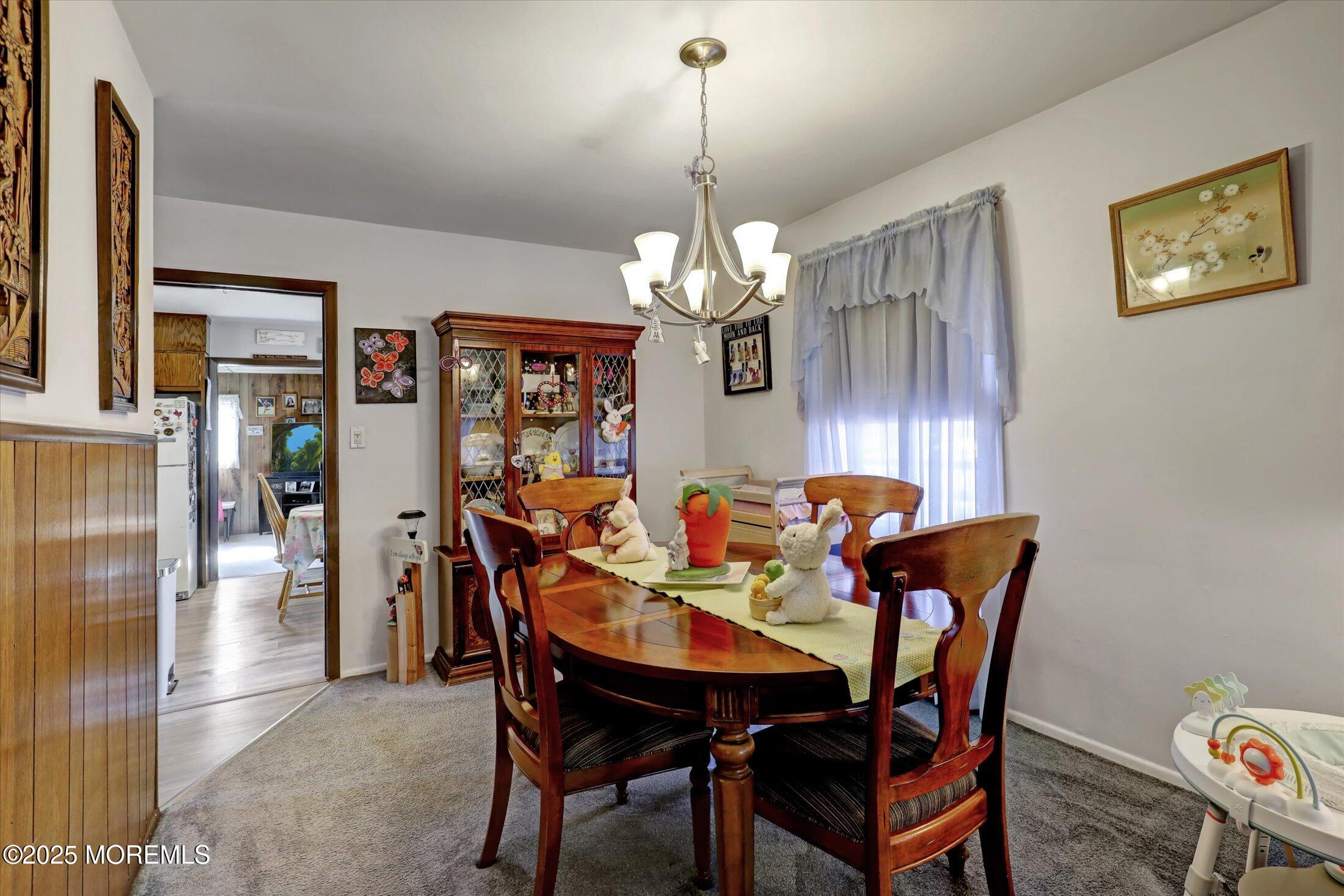1 Peach Tree Road Oakhurst, NJ 07755 - Photo 25 of 42 a view of a dining room with furniture and chandelier