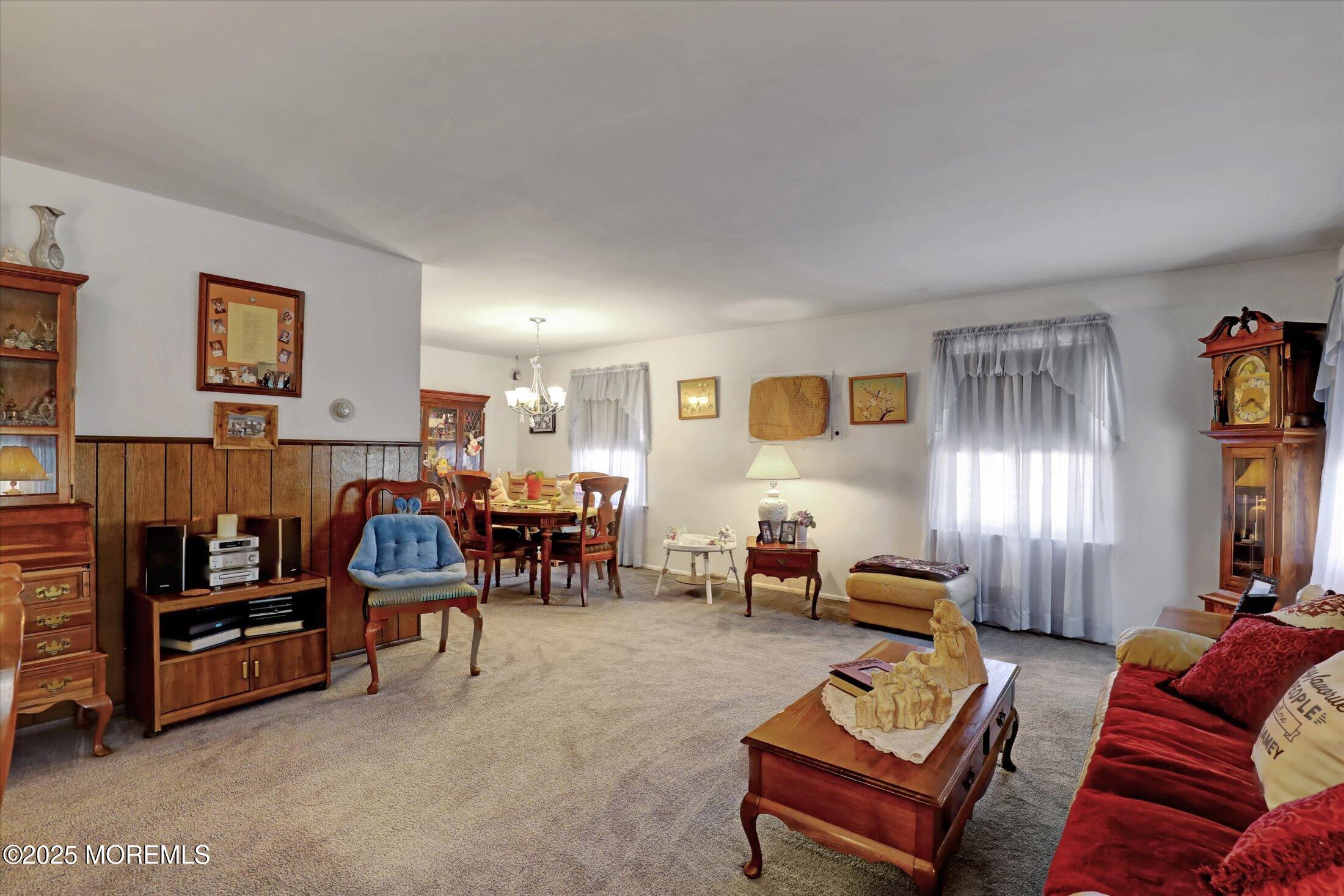 1 Peach Tree Road Oakhurst, NJ 07755 - Photo 27 of 42 a living room with furniture and a flat screen tv