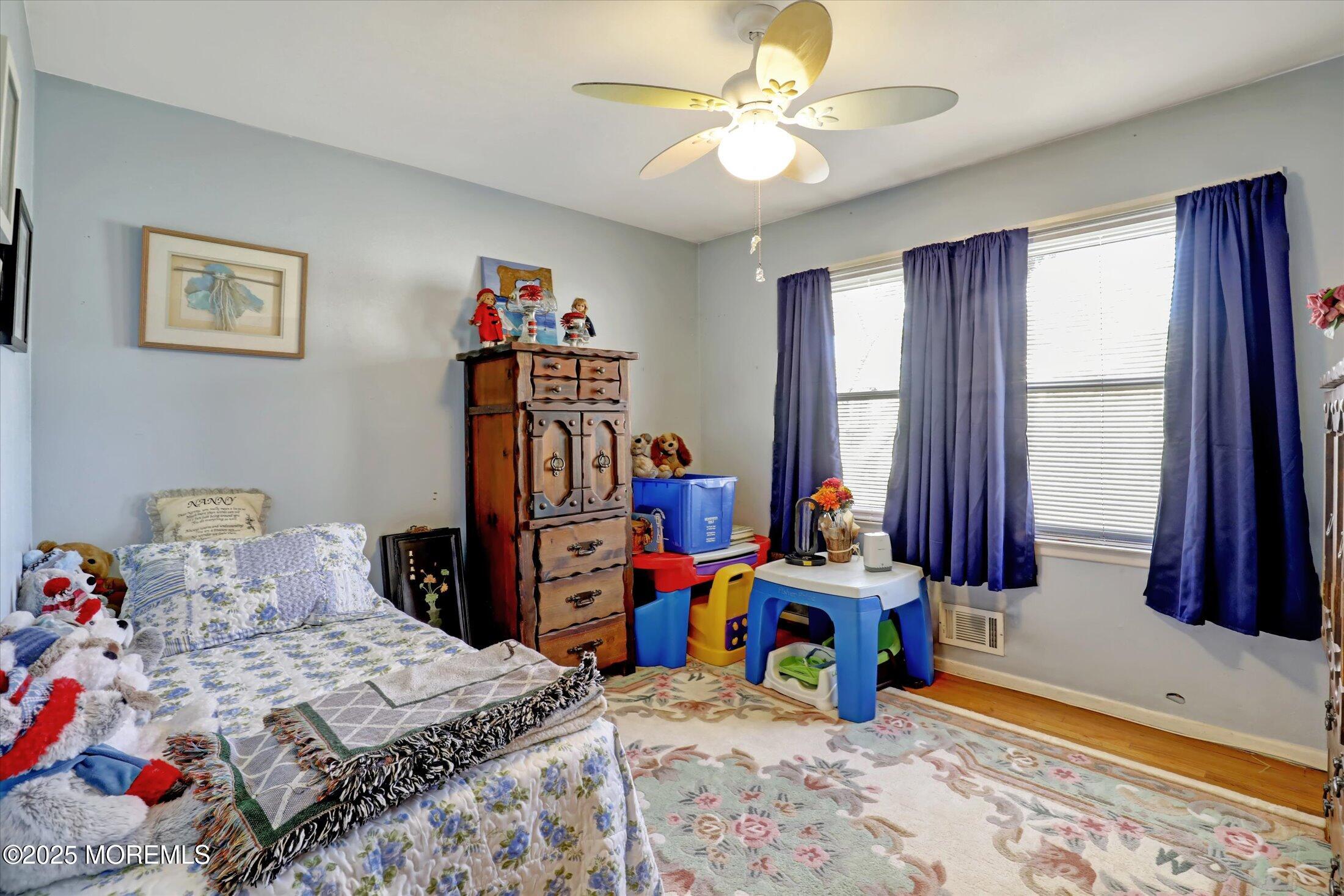 1 Peach Tree Road Oakhurst, NJ 07755 - Photo 29 of 42 a bedroom with bed and window