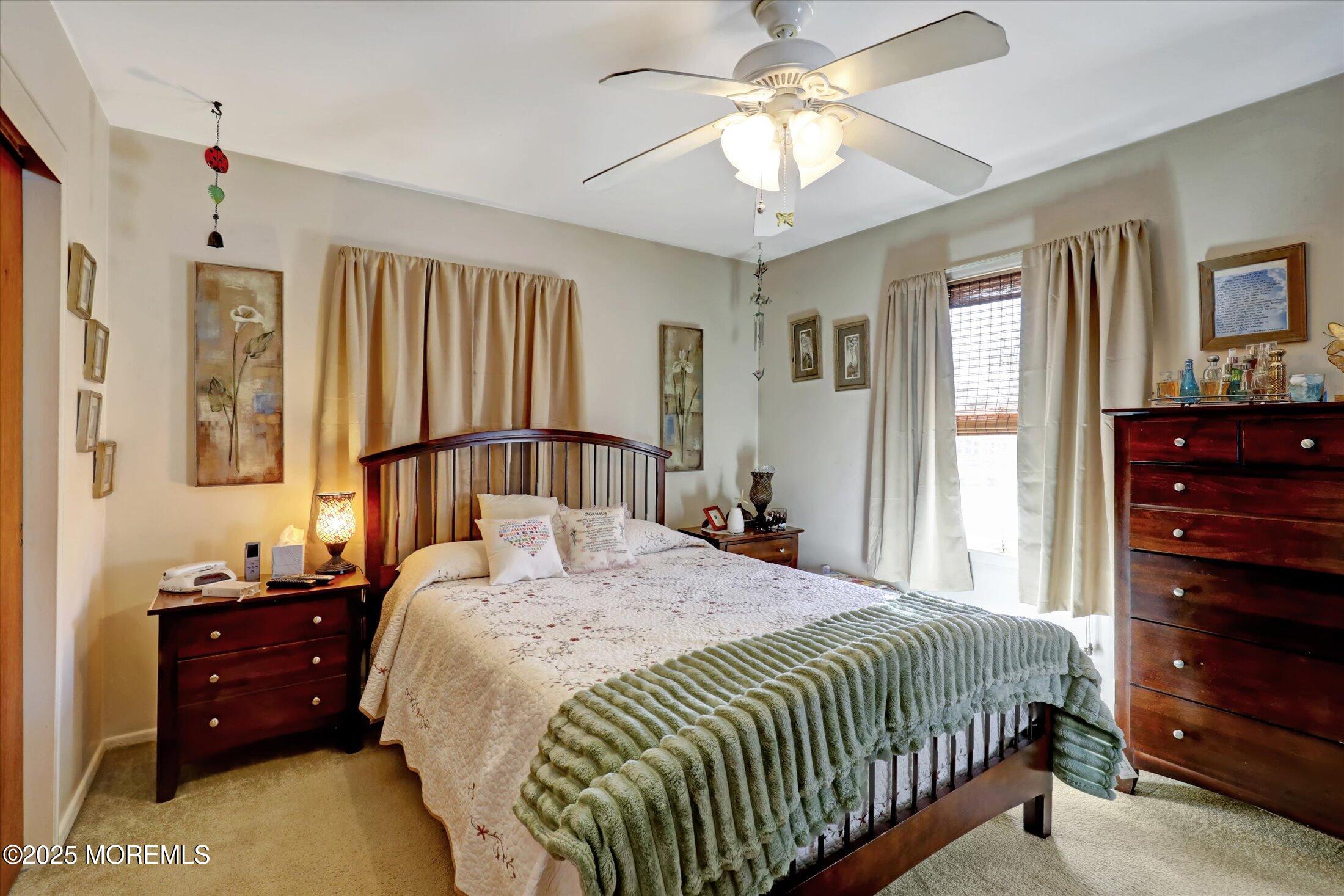 1 Peach Tree Road Oakhurst, NJ 07755 - Photo 32 of 42 a bedroom with a bed and a dresser