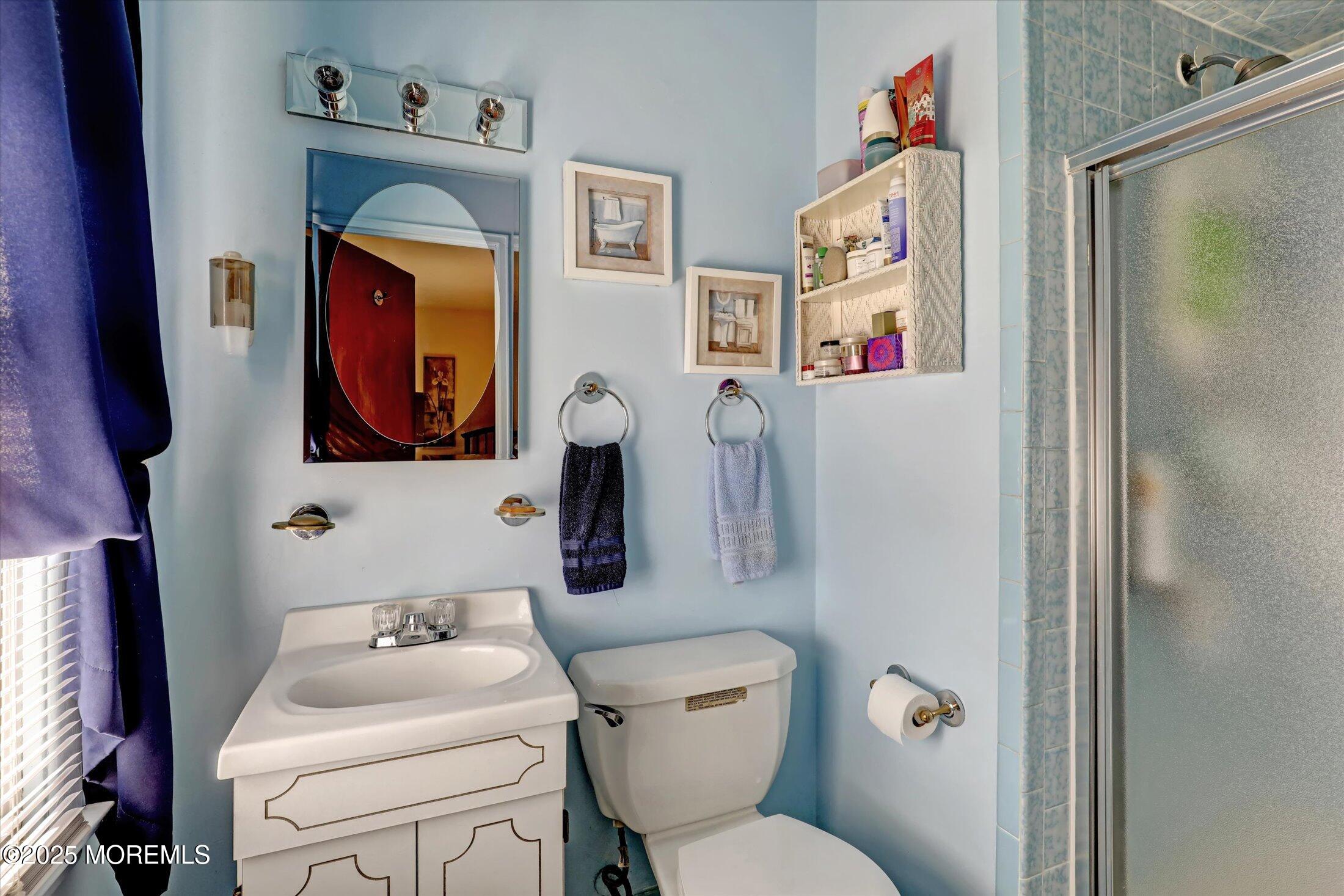 1 Peach Tree Road Oakhurst, NJ 07755 - Photo 33 of 42 a bathroom with a toilet sink and mirror