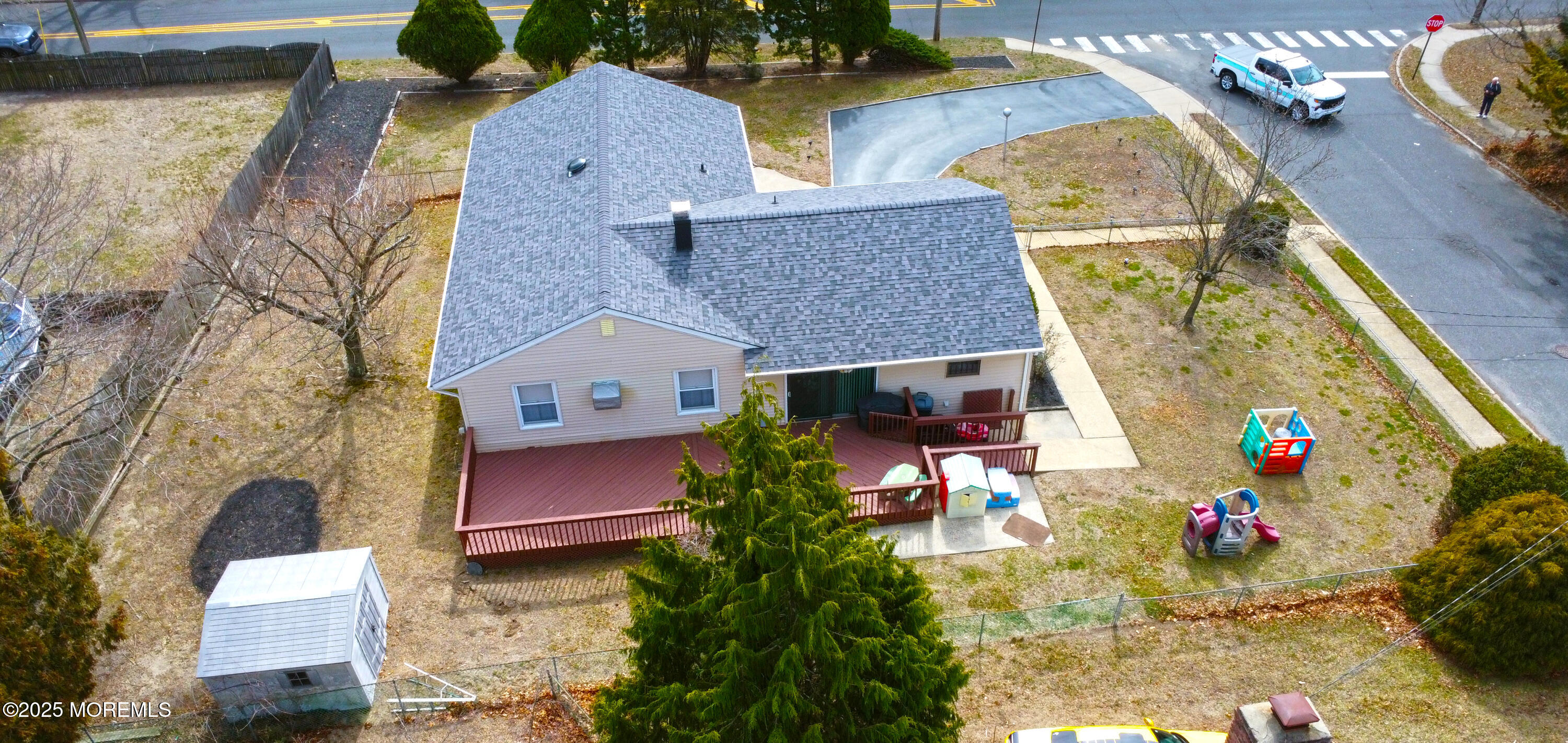 1 Peach Tree Road Oakhurst, NJ 07755 - Photo 9 of 42 an aerial view of a house with a yard and a large tree
