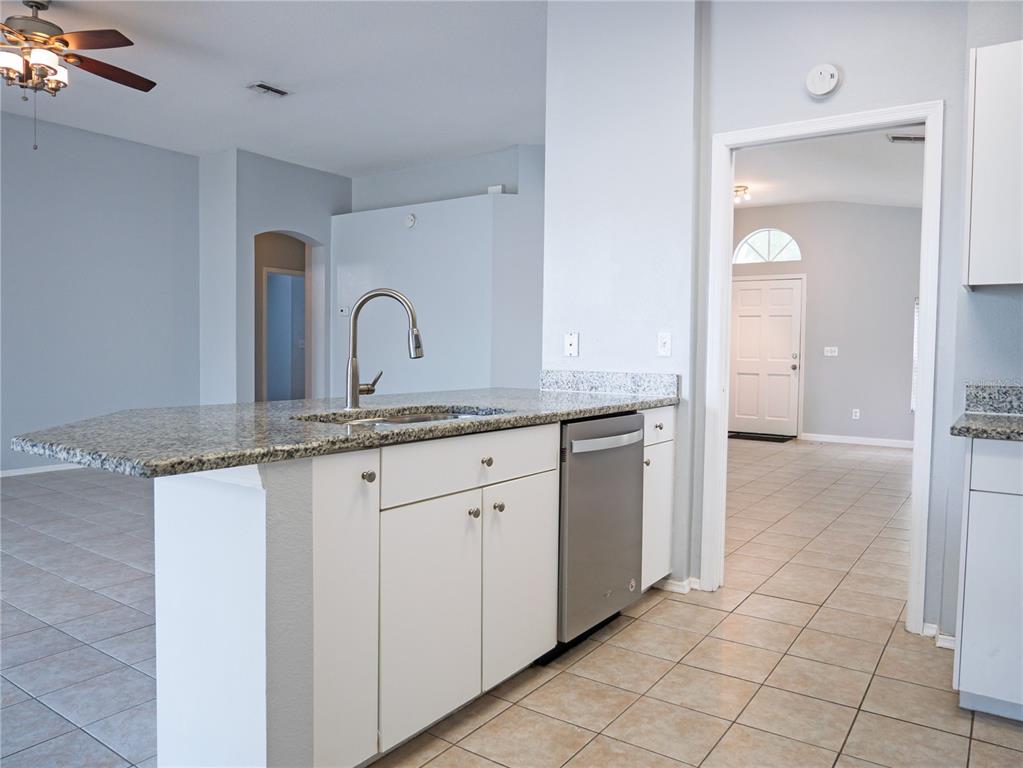 4768 Ridgemoor Circle Palm Harbor, FL 34685 - Photo 16 of 41 a view of a granite countertop cabinets with a granite countertop tops