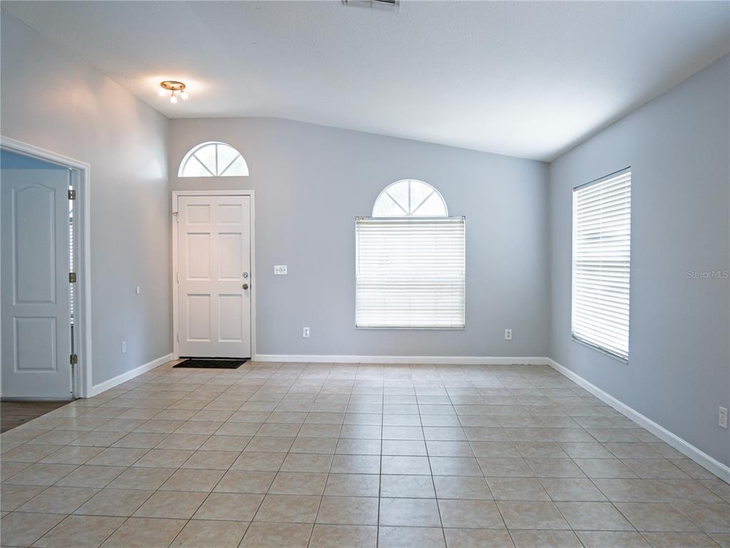 4768 Ridgemoor Circle Palm Harbor, FL 34685 - Photo 2 of 41 an empty room with windows and closet
