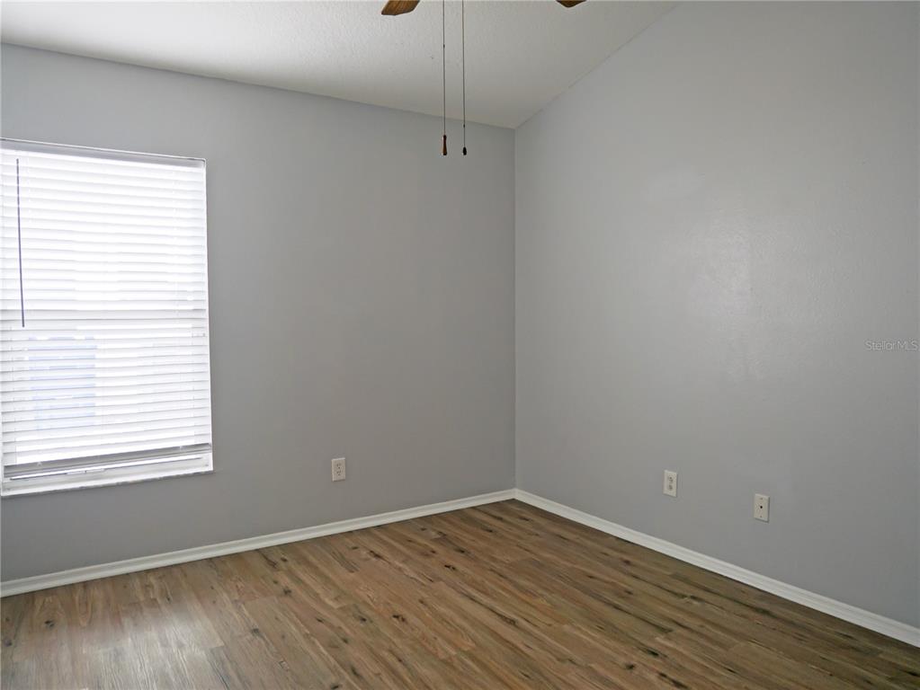 4768 Ridgemoor Circle Palm Harbor, FL 34685 - Photo 23 of 41 a view of a room with wooden floor and window