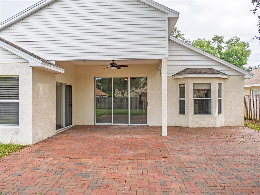 4768 Ridgemoor Circle Palm Harbor, FL 34685 - Photo 29 of 41 a view of a house with a yard and potted plants