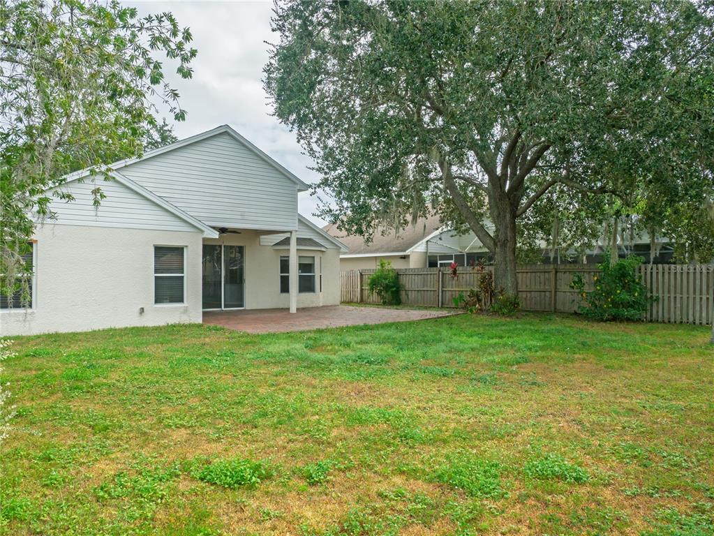 4768 Ridgemoor Circle Palm Harbor, FL 34685 - Photo 33 of 41 a view of a house with backyard and garden