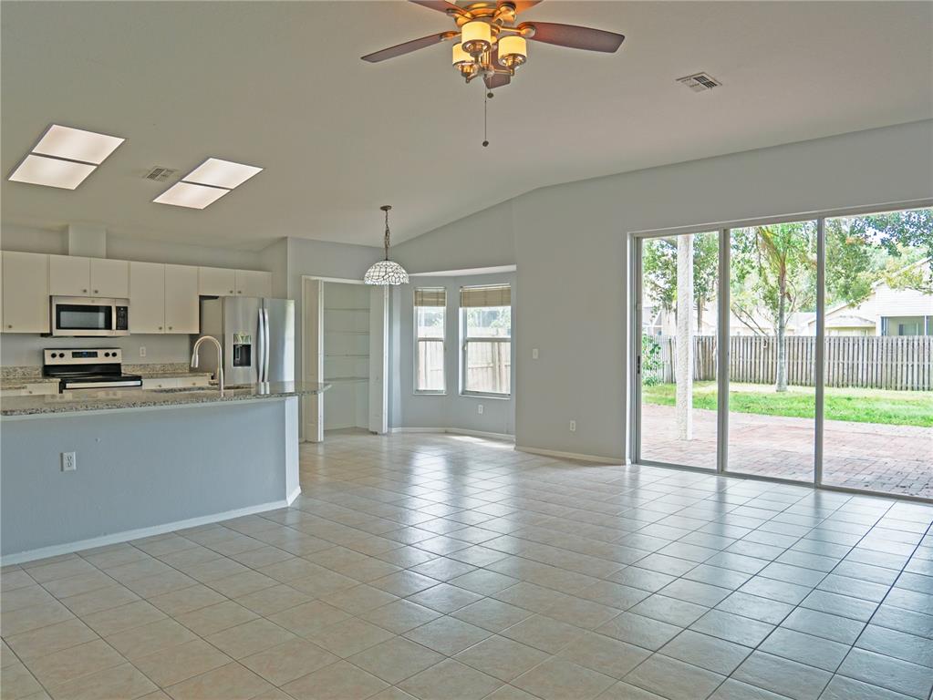 4768 Ridgemoor Circle Palm Harbor, FL 34685 - Photo 5 of 41 a view of a kitchen with a sink and cabinets