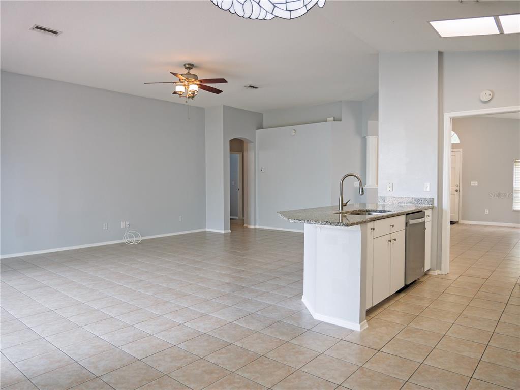 4768 Ridgemoor Circle Palm Harbor, FL 34685 - Photo 8 of 41 a kitchen with a sink cabinets and window
