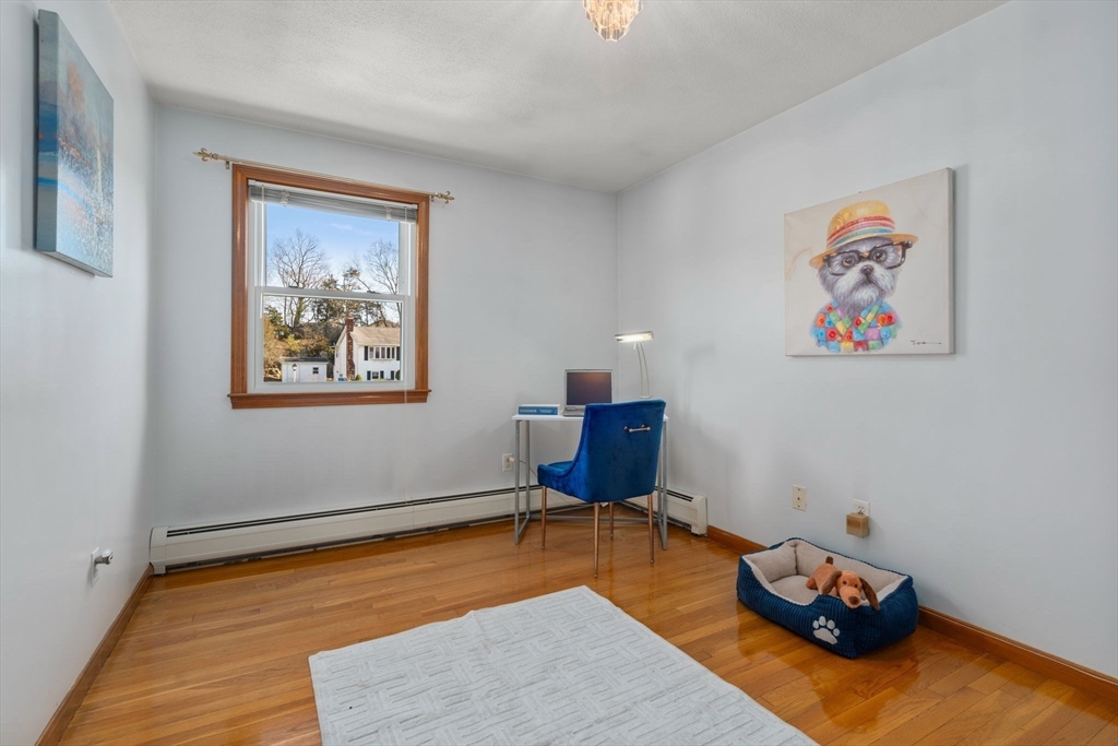 8 Sycamore Lane Saugus, MA 01906 - Photo 18 of 39 a living room with furniture and a wooden floor