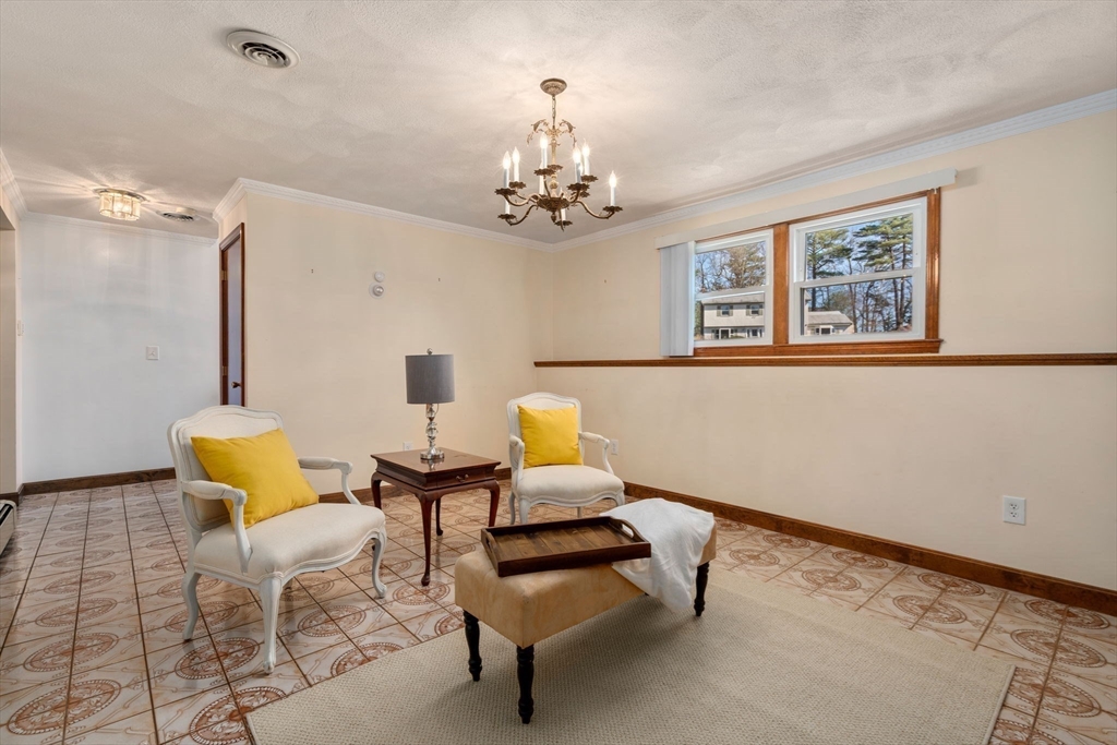 8 Sycamore Lane Saugus, MA 01906 - Photo 22 of 39 a bedroom with furniture and wooden floor