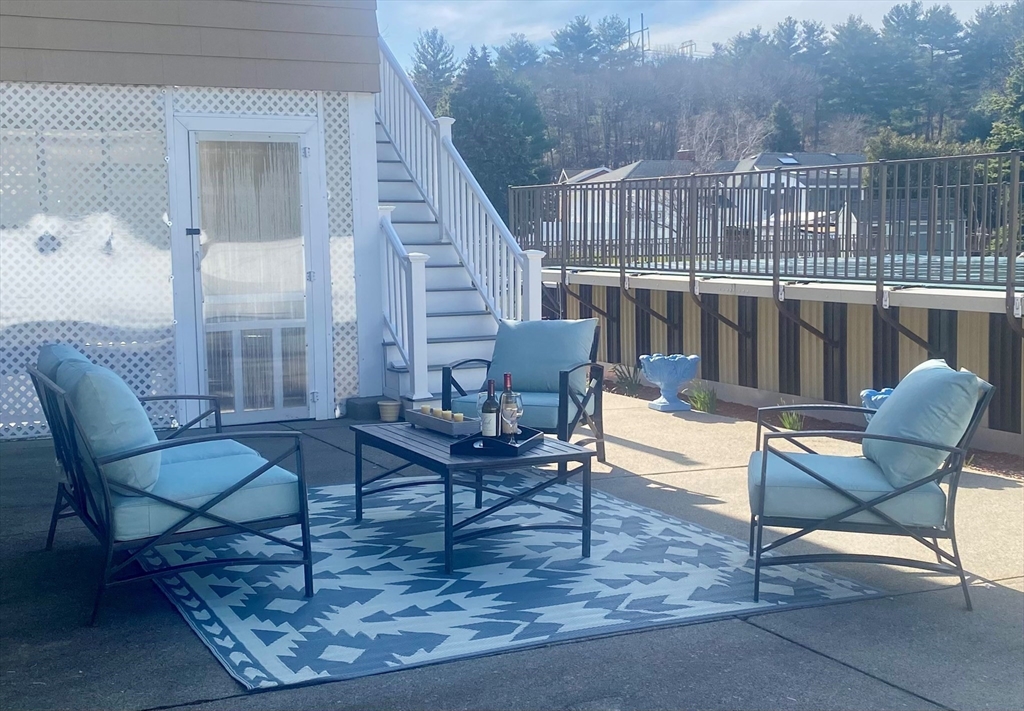 8 Sycamore Lane Saugus, MA 01906 - Photo 30 of 39 a living room with furniture and a floor to ceiling window