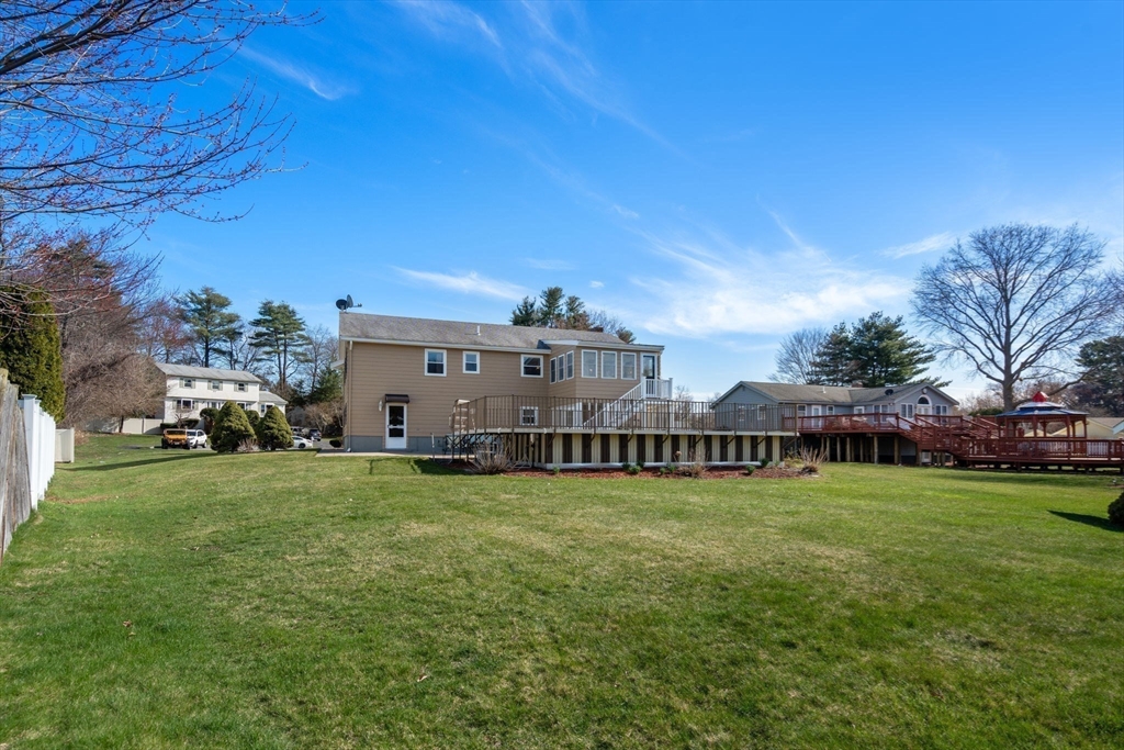 8 Sycamore Lane Saugus, MA 01906 - Photo 33 of 39 a view of a house with a big yard