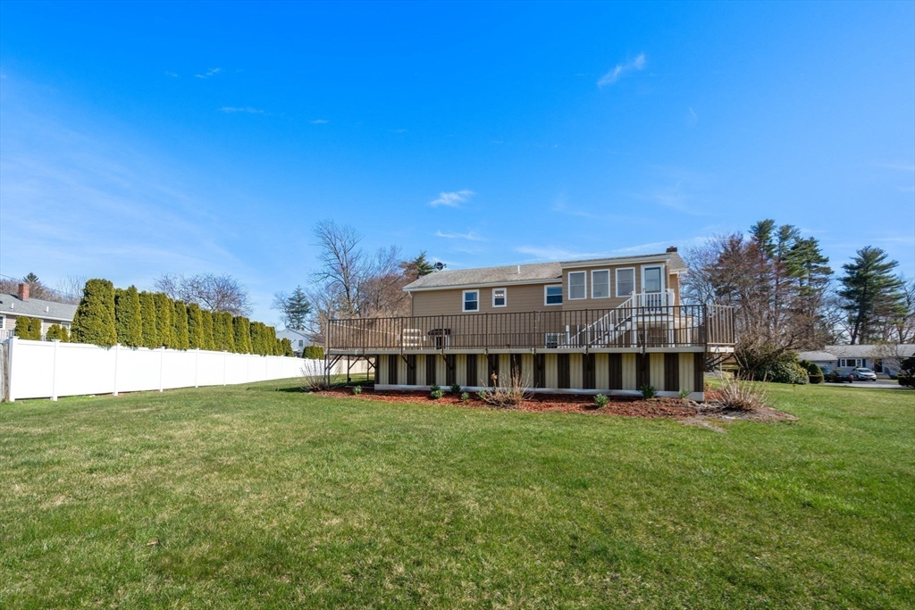 8 Sycamore Lane Saugus, MA 01906 - Photo 34 of 39 a view of a house with a big yard
