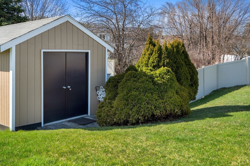 8 Sycamore Lane Saugus, MA 01906 - Photo 36 of 39 a view of a small house with a yard