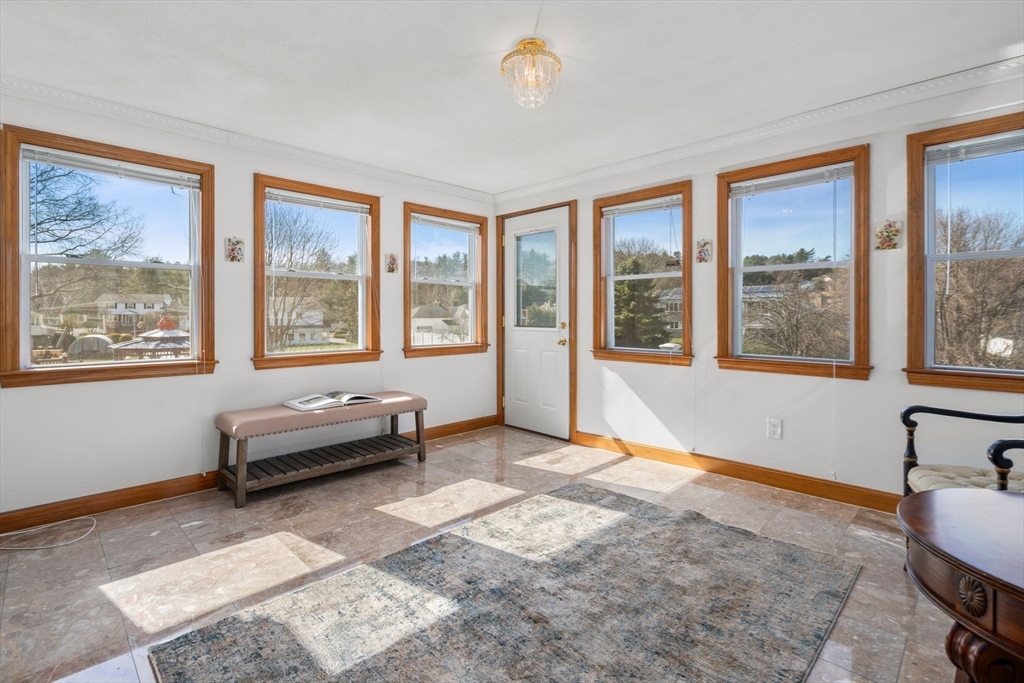 8 Sycamore Lane Saugus, MA 01906 - Photo 10 of 39 a living room with furniture and a window