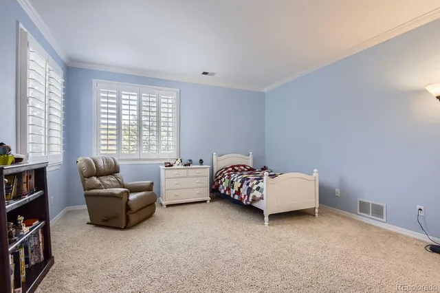 a bed room with furniture and a window