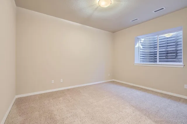 a bathroom with a double vanity sink mirror and toilet