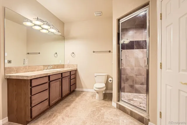 a view of a room with a large window and chairs