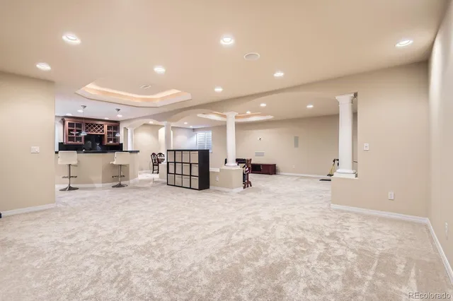 a room with gym equipment and windows