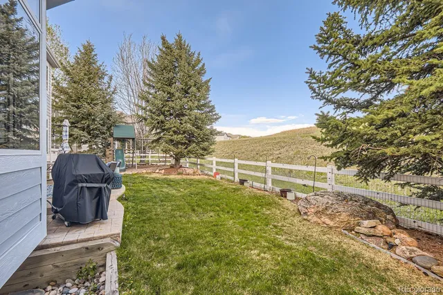 a view of a chairs and table in the patio