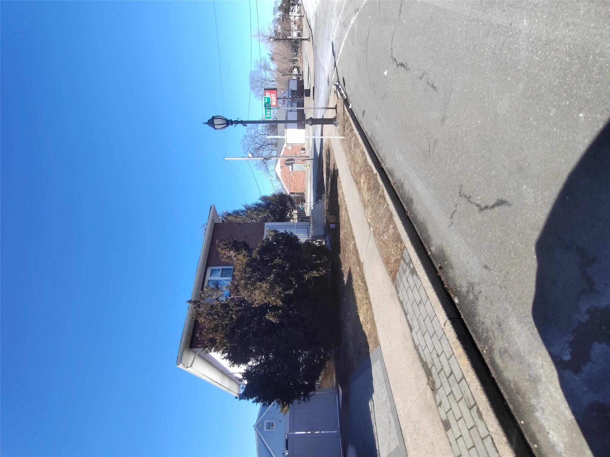 2167 A Great Neck Road Copiague, NY 11726 - Photo 1 of 18 View of asphalt road with sidewalks, street lighting, and curbs