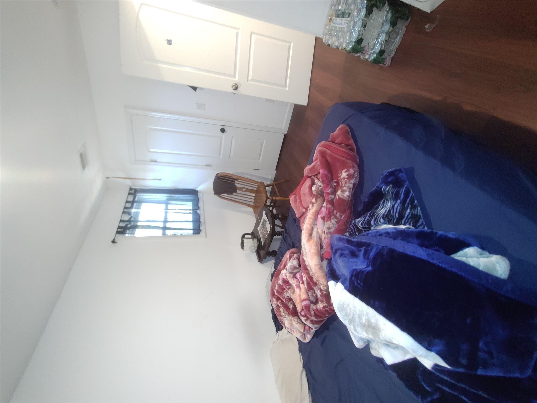 2167 A Great Neck Road Copiague, NY 11726 - Photo 12 of 18 Bedroom featuring wood finished floors