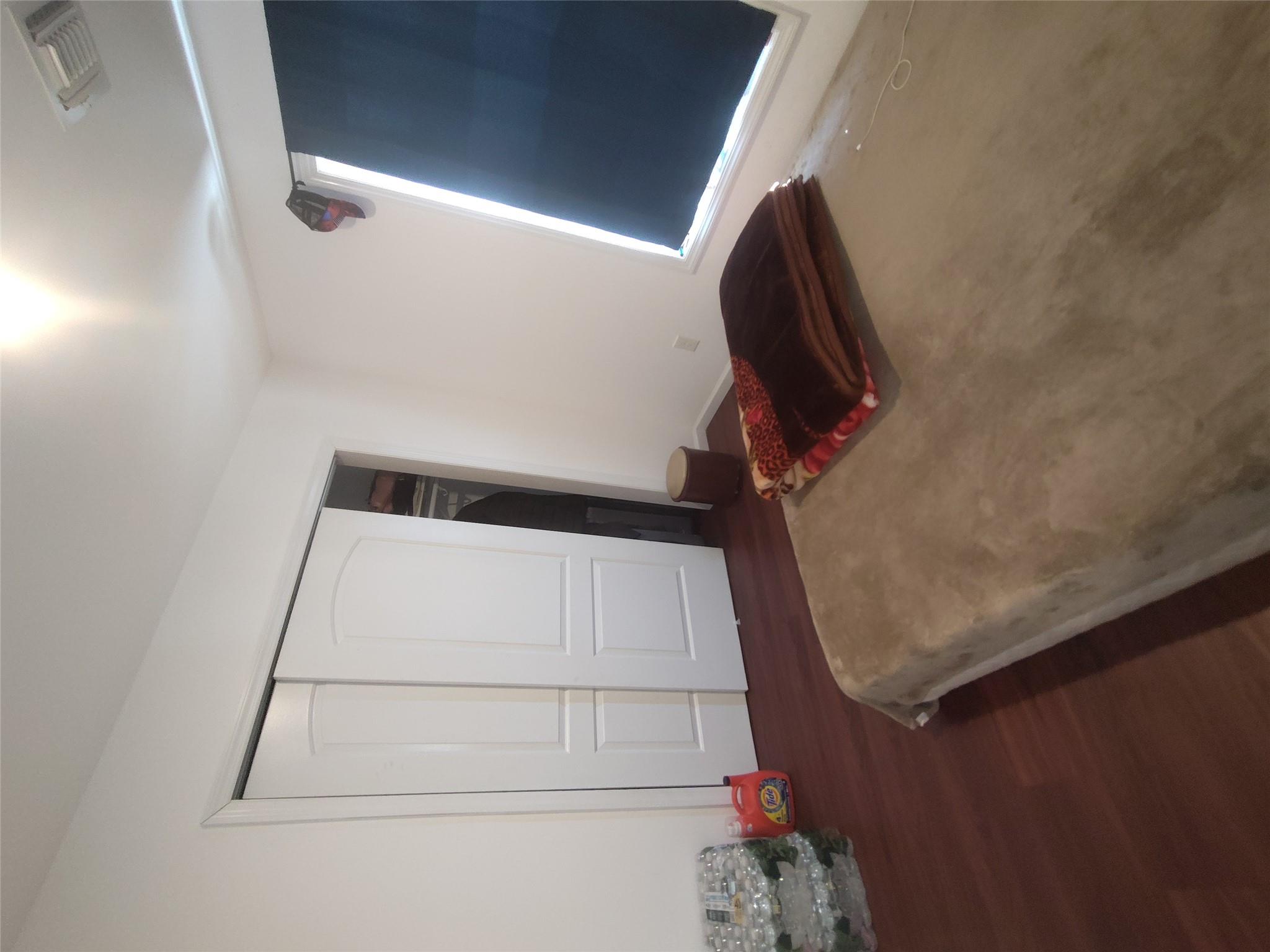 2167 A Great Neck Road Copiague, NY 11726 - Photo 13 of 18 Bedroom with wood finished floors and a closet