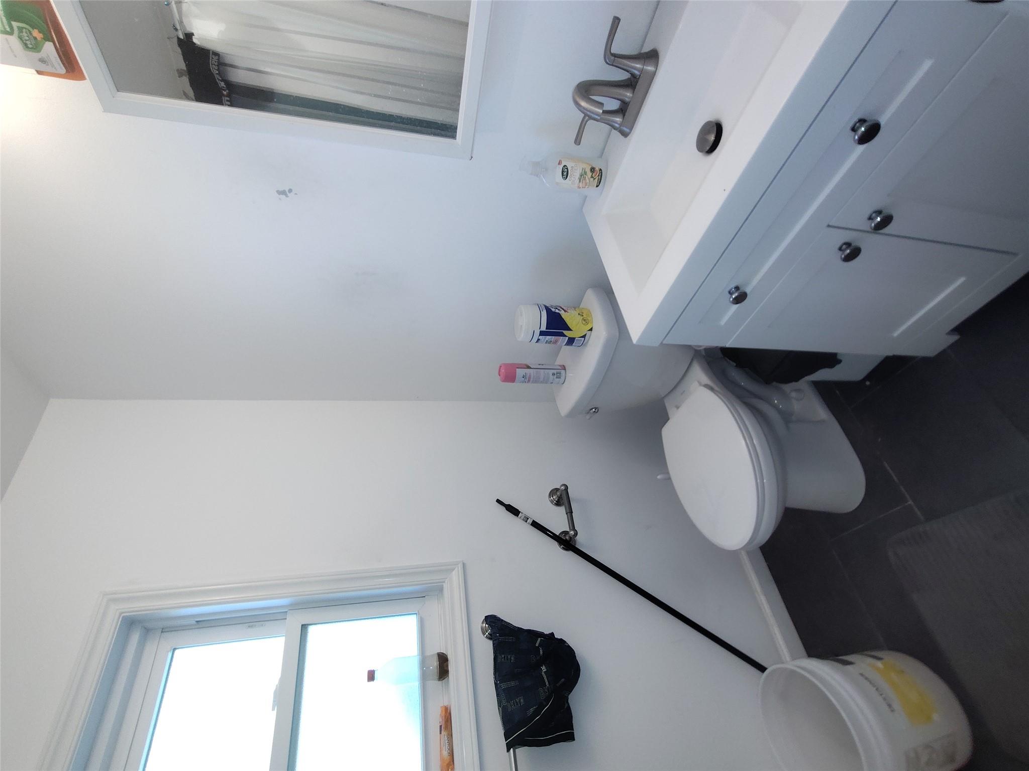 2167 A Great Neck Road Copiague, NY 11726 - Photo 14 of 18 Bathroom featuring vanity, tile patterned floors, and a shower with curtain