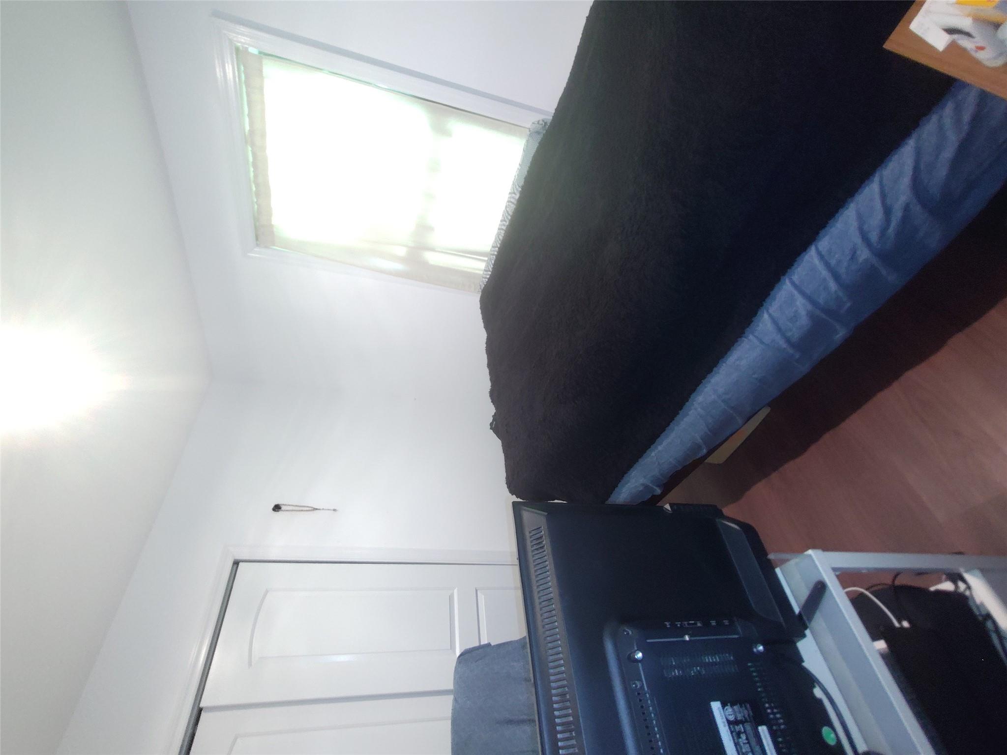 2167 A Great Neck Road Copiague, NY 11726 - Photo 9 of 18 Bedroom with wood finished floors and a closet