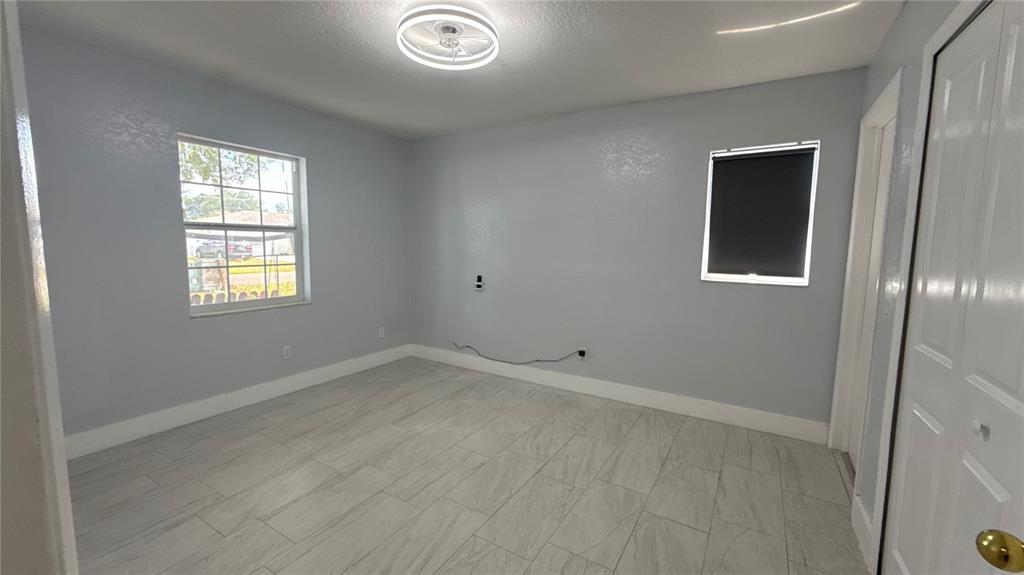 8106 Wichita Way Tampa, FL 33619 - Photo 9 of 21 an empty room with windows