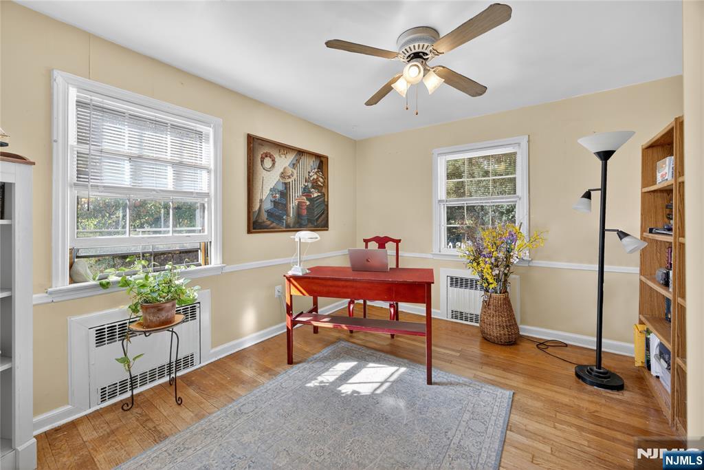 370 Goffle Road Hawthorne, NJ 07506 - Photo 19 of 37 a living room with furniture a rug and a window